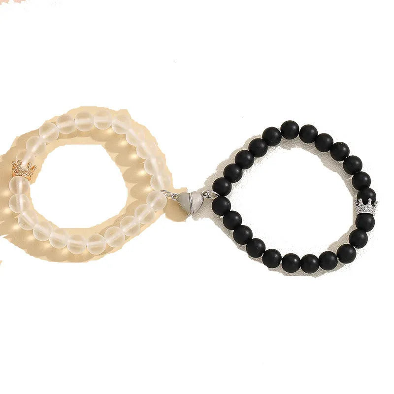 2pcs handmade glow-in-the-dark crown beaded bracelets in white and black with glass beads and luminous heart charm