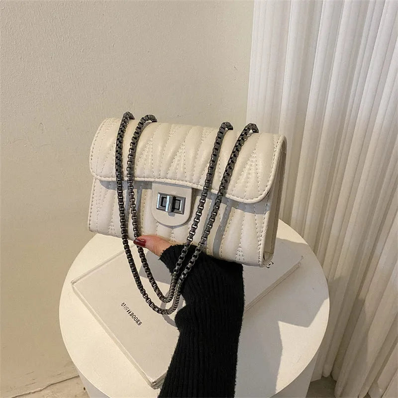 Retro textured diamond pattern small women's handbag in PU material showing internal mobile phone and document compartments