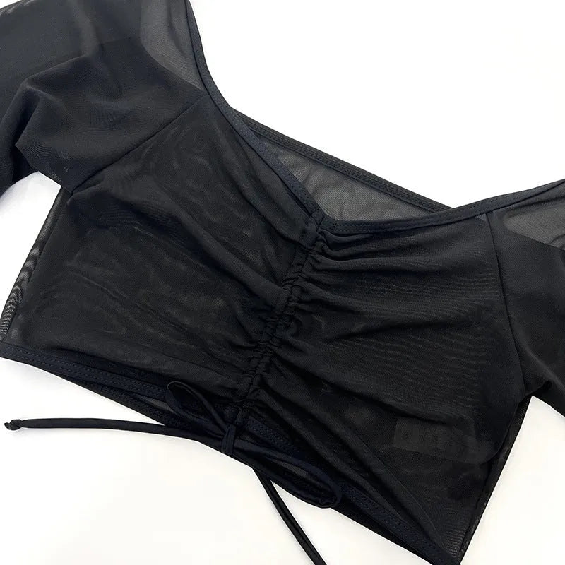 Black mesh women's bikini set with long sleeves, a four-piece swimsuit for swimming sports.