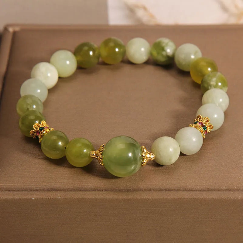 Women's bracelet made of green Xiuyan jade with an original sweet Mori style design.