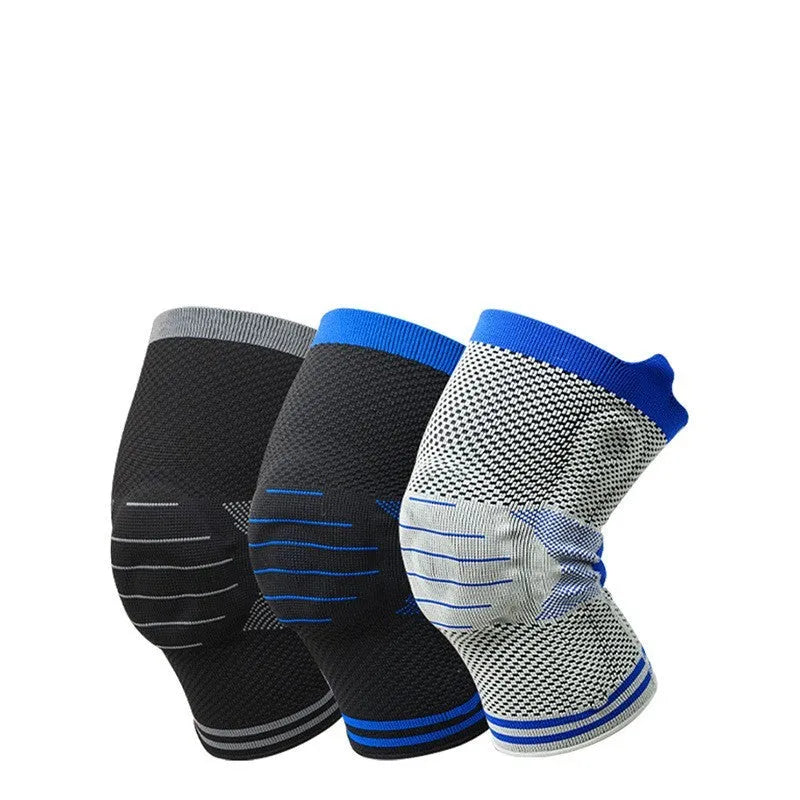 A cotton knee pad with a silicone shock absorber, shown in a grey and blue colour combination.
