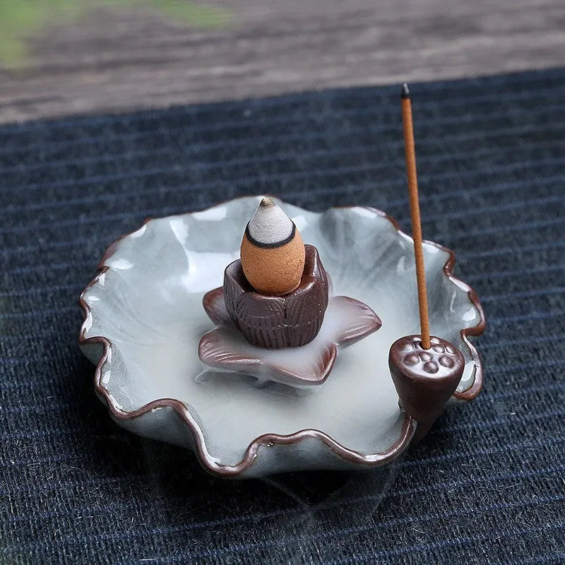 Ceramic reverse flow incense burner in purple clay with Ge kiln finish and lotus or plum blossom design