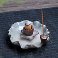 Ceramic reverse flow incense burner in purple clay with Ge kiln finish and lotus or plum blossom design