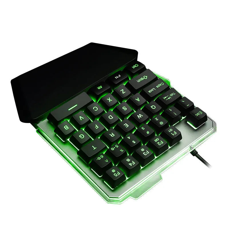 Black G40 Flow Colour one-handed mechanical keyboard with RGB backlit keys on a desk.