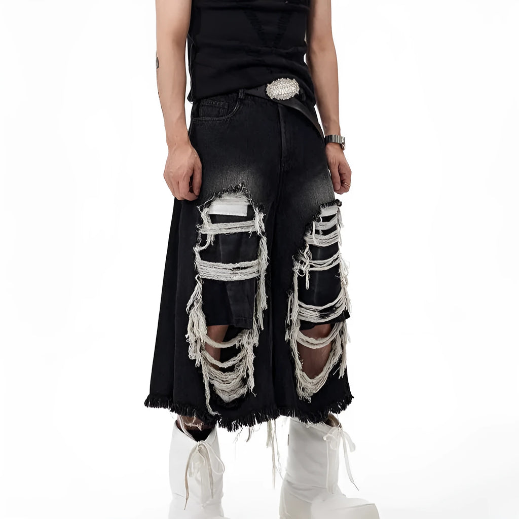 Black wide leg cropped jeans with mid-high waist and ripped patch detail on the legs.