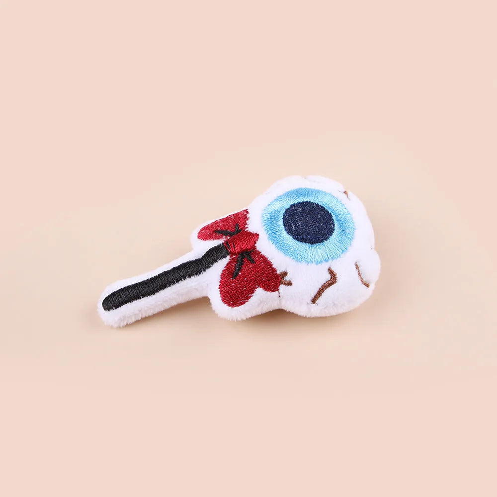Small plush cat teaser toy with feather wand attachment in candy design