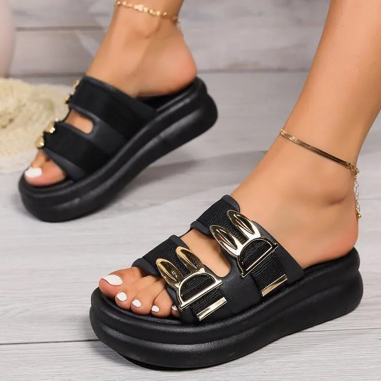 Women's apricot suede slippers with a thick rubber sole, shown from the side.