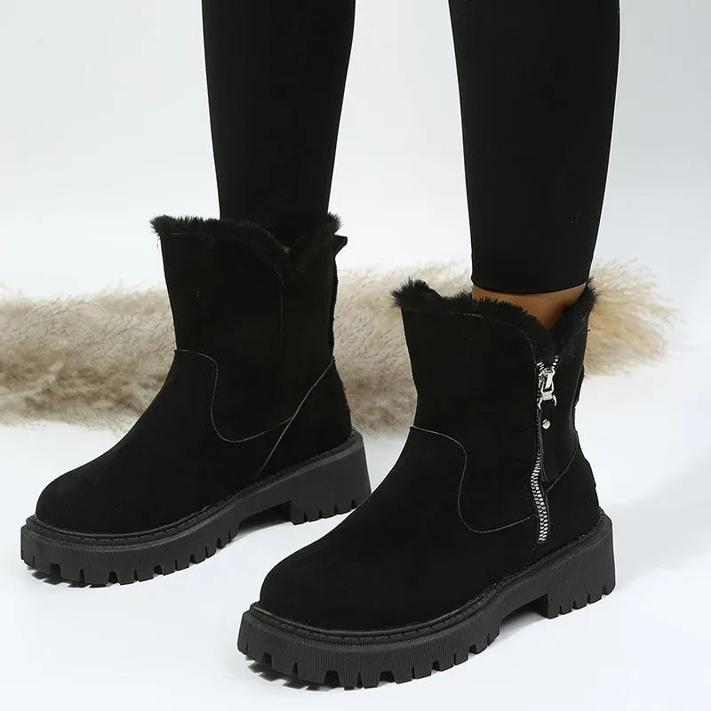Women's black faux suede high-top snow boots with a side zipper and thick plush lining.