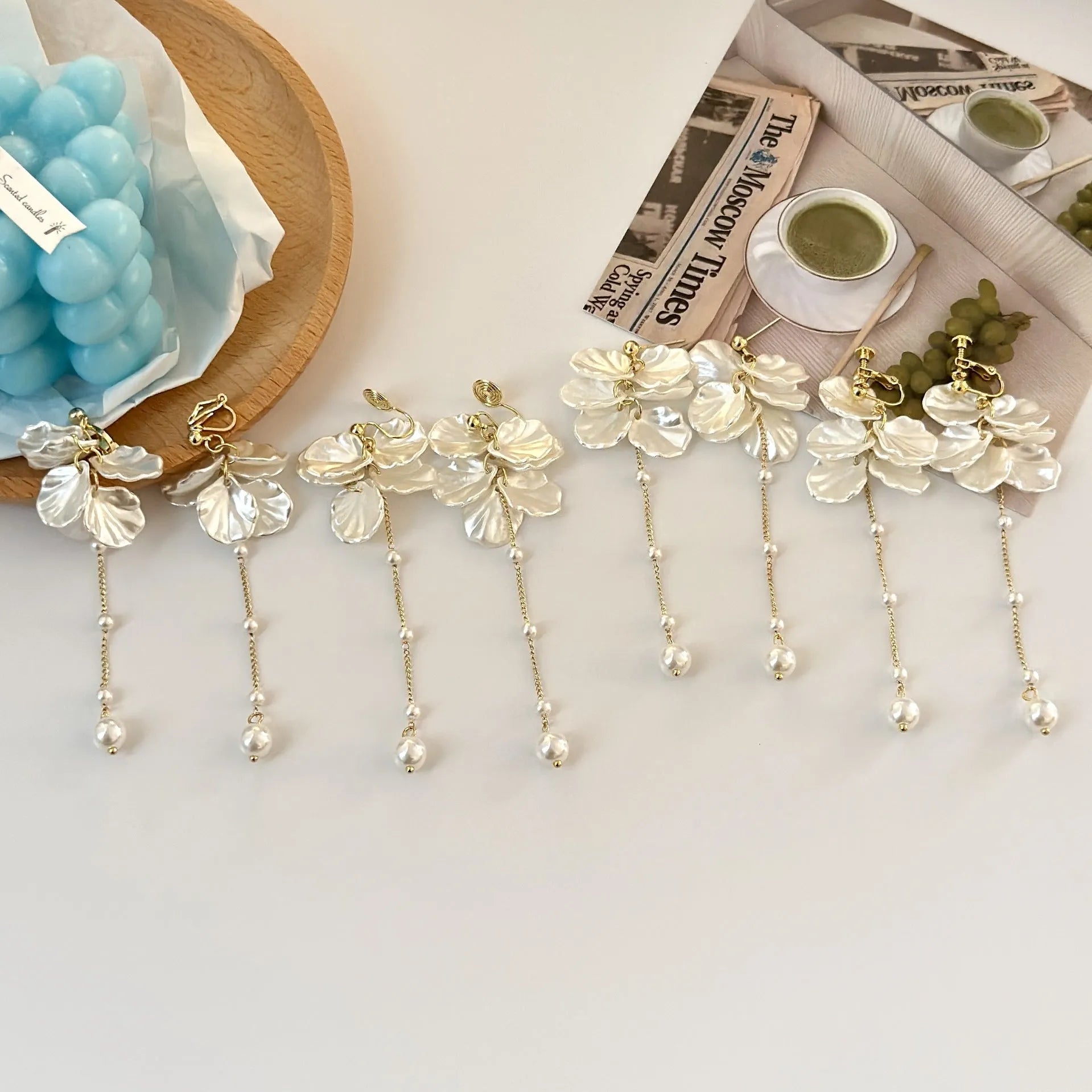 Women's acrylic shell pearl tassel earrings showing 8.8cm drop length and cushion ear clip option