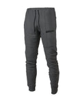Men's black cotton joggers with elastic waist and velcro side pockets, loose fit, for sports and casual wear