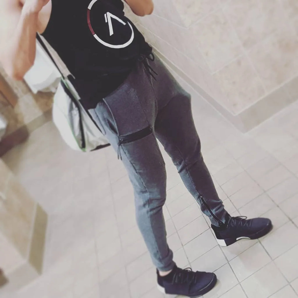 Men's black cotton joggers with elastic waist and velcro side pockets, loose fit, for sports and casual wear