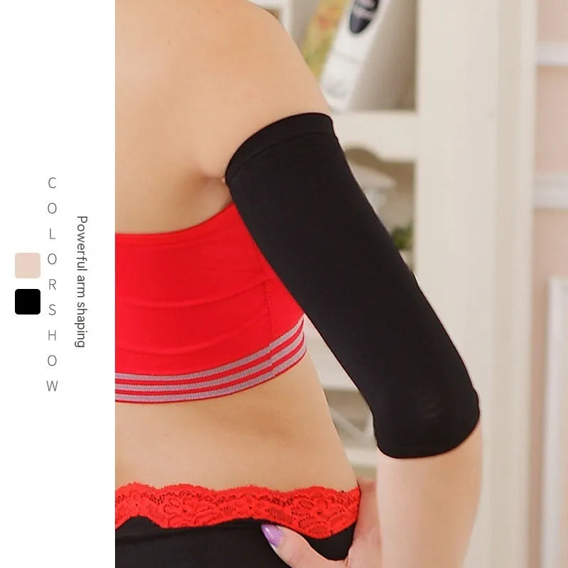 Pair of women's black nylon shaping sleeves for upper arm coverage.