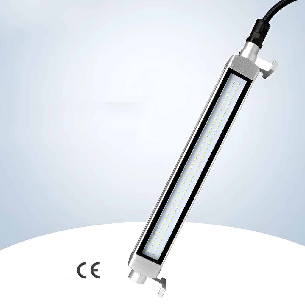 Long, rectangular LED work light with aluminium body and tempered glass front, mounted with a bracket for CNC machine tools.