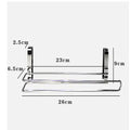 Silver stainless steel wire towel rack hanging on a kitchen cabinet door.