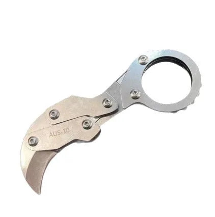 Small stainless steel 420J2 folding knife with 2.6cm blade on table