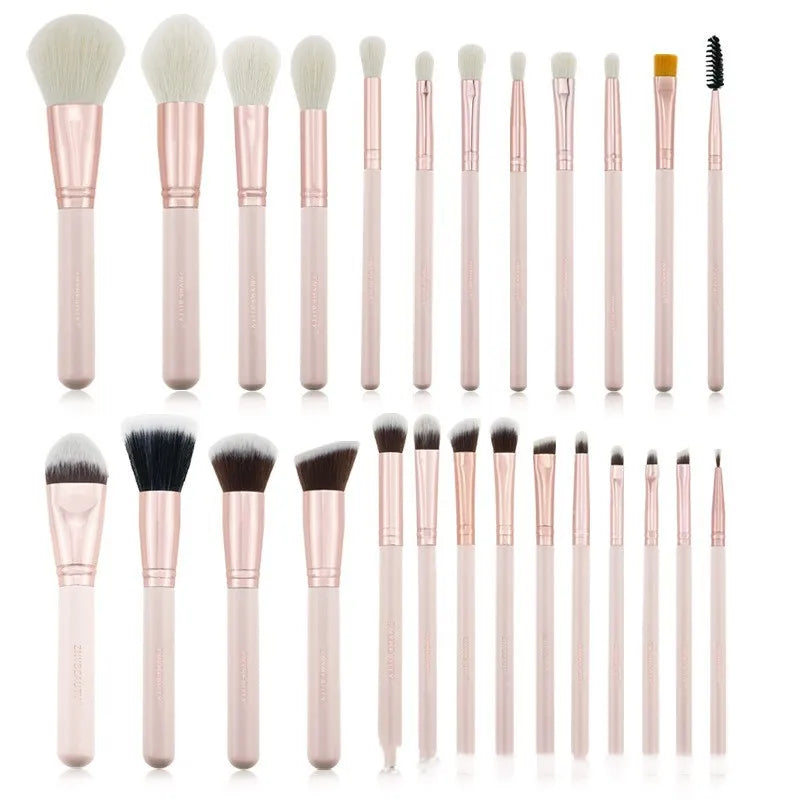 26 pink makeup brushes with wooden handles arranged in a PU carry case.