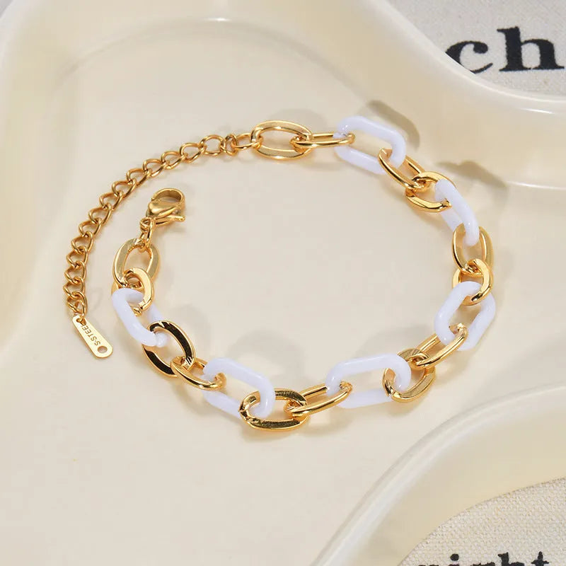 Stainless steel and resin heart-shaped bracelet for women with double layer design.