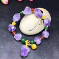 Natural purple amethyst bead bracelet for women with a silver Fu character charm.