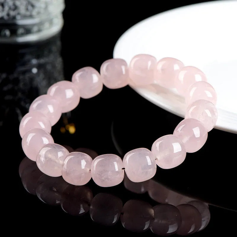 Pink natural bamboo crystal bracelet with 11x12mm barrel beads and geometry design