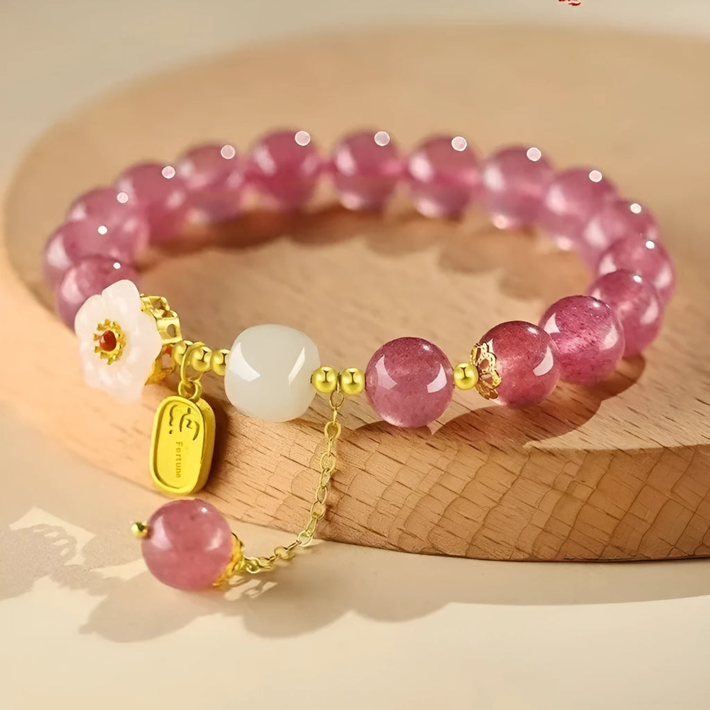 Handcrafted strawberry quartz crystal bracelet with Hetian jade peach blossom design for women