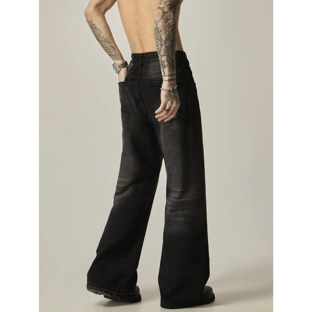 Black loose straight-leg retro jeans with zip fly opening on mannequin