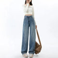 Women's retro blue high-waist wide-leg jeans with straight cut on a model
