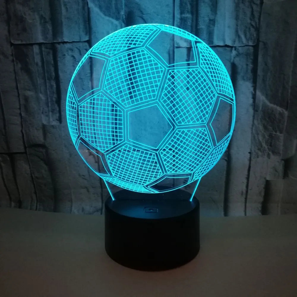 3D football-shaped acrylic night light glowing in blue with a black ABS base and remote control.