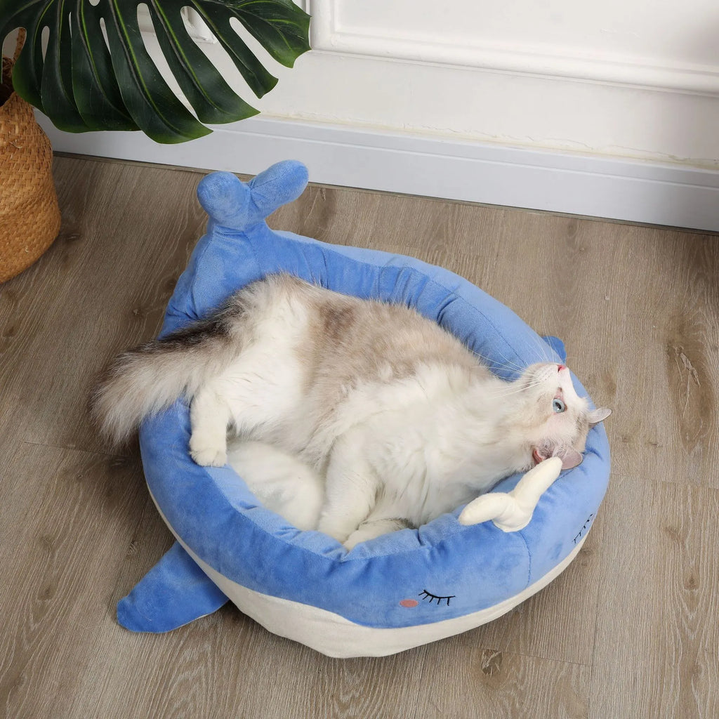 Blue duck-shaped fluffy pet bed sofa for small dogs and cats on a wooden floor.