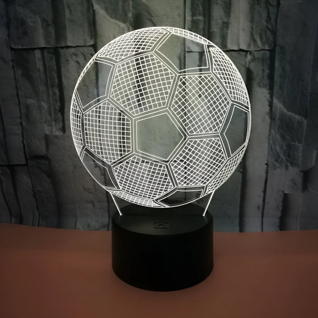 3D football-shaped acrylic night light glowing in blue with a black ABS base and remote control.