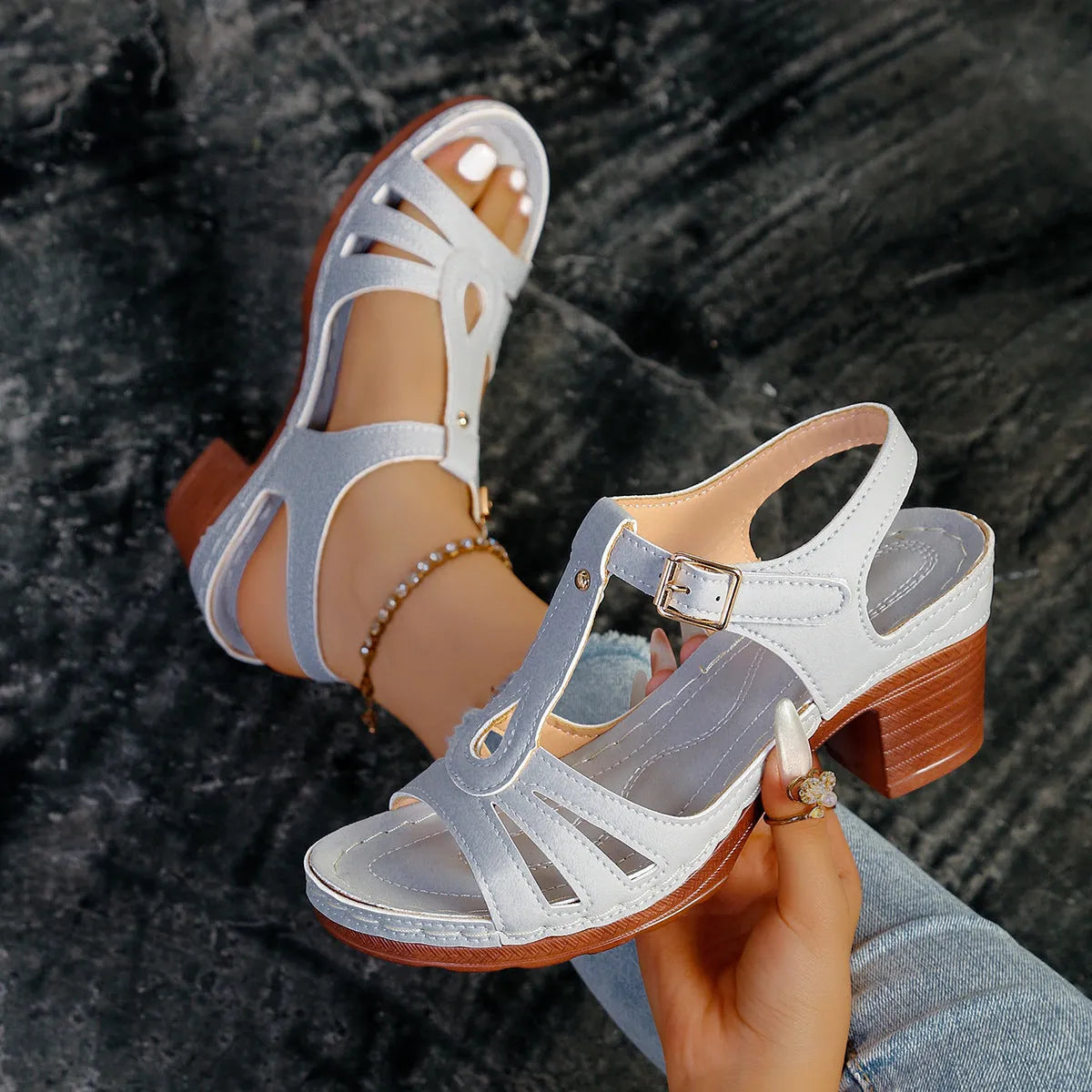 Women's black PU peep toe wedge sandals with an adjustable buckle strap.