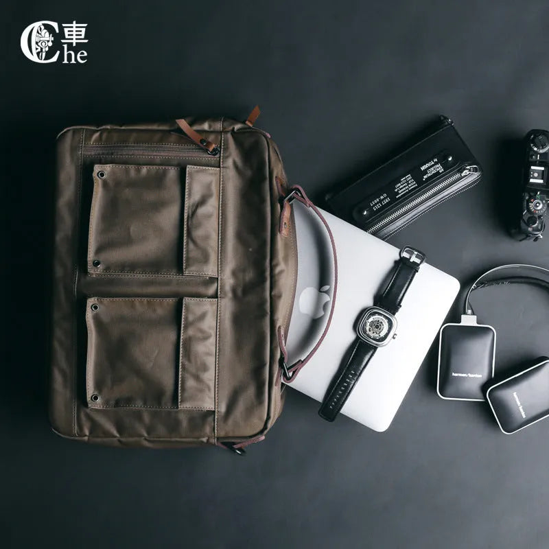 Dpark single shoulder sling laptop bag in black, open showing padded interior for a 15-inch laptop.