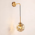 Modern glass wall lamp with minimalist design shown in bedroom setting