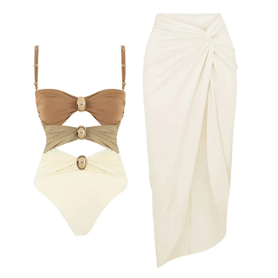 Women's solid colour one-piece swimsuit with detachable skirt and gold button detail in nylon fabric