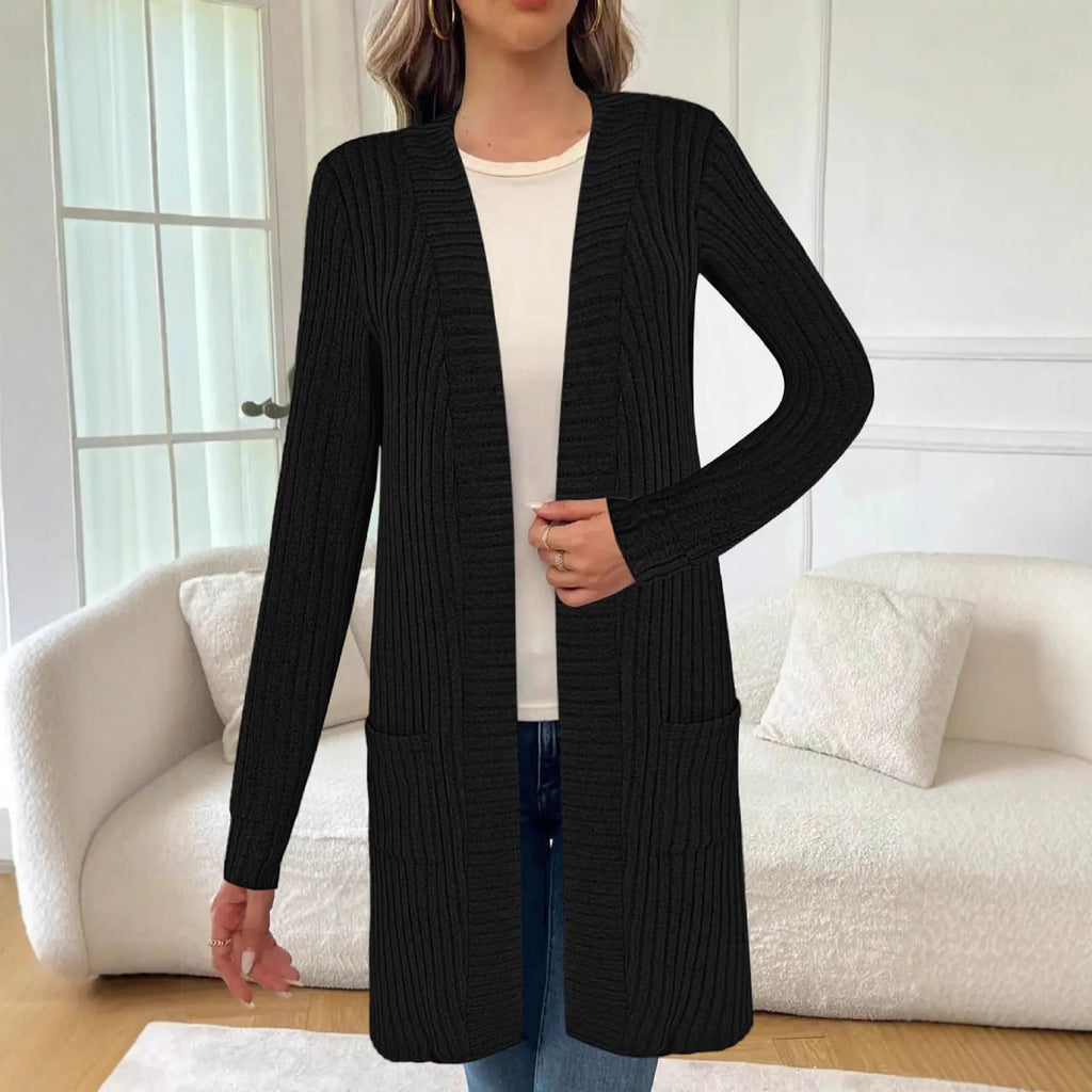 Long sleeve loose pocket knitted cardigan jacket in grey on a hanger.