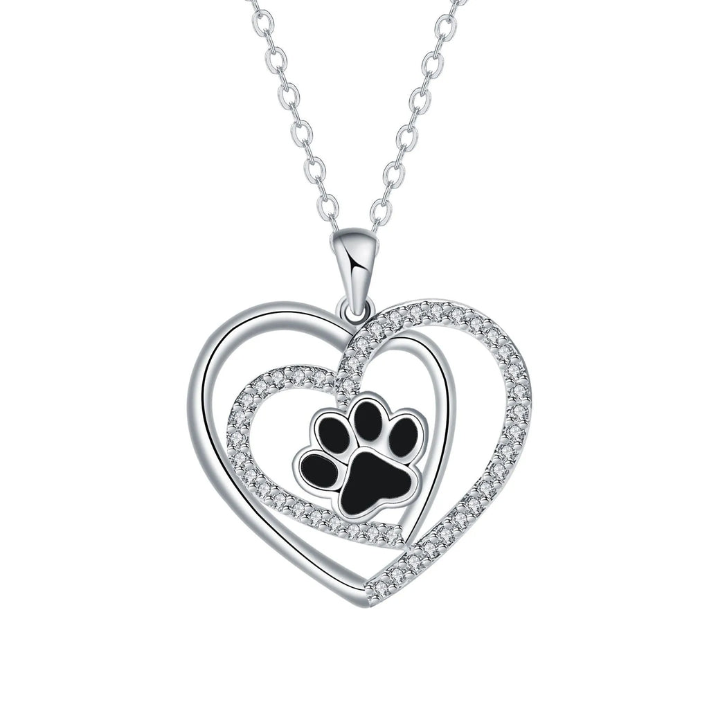 Women's necklace with a copper dog paw print heart pendant on a cross chain.