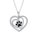 Women's necklace with a copper dog paw print heart pendant on a cross chain.