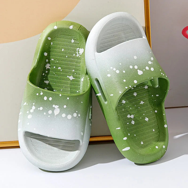 Gradient coloured PVC slipper sandals for children on a white background.