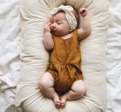Beige portable cotton baby nest crib for newborns measuring 75cm by 45cm