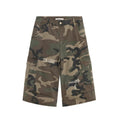 Men's retro patch ripped camouflage cropped jeans showing loose straight leg fit and distressed detailing