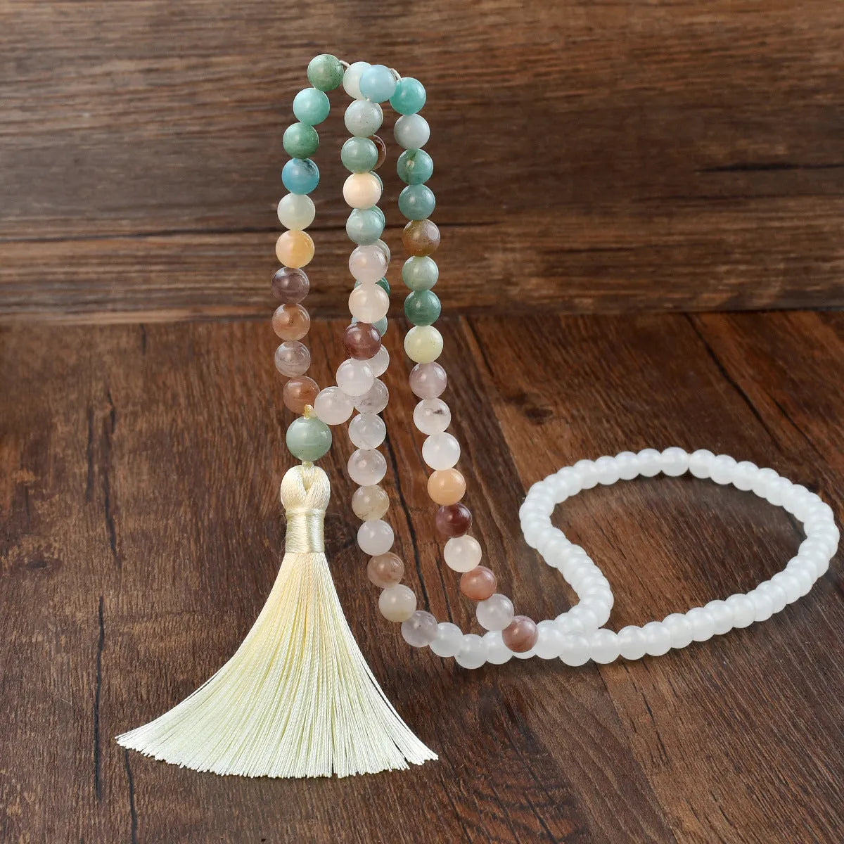 Long 108 natural stone bead necklace with mixed gemstone tassel pendant in bohemian style.
