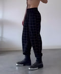 Men's plaid trousers with apron-style front panelling in casual fit