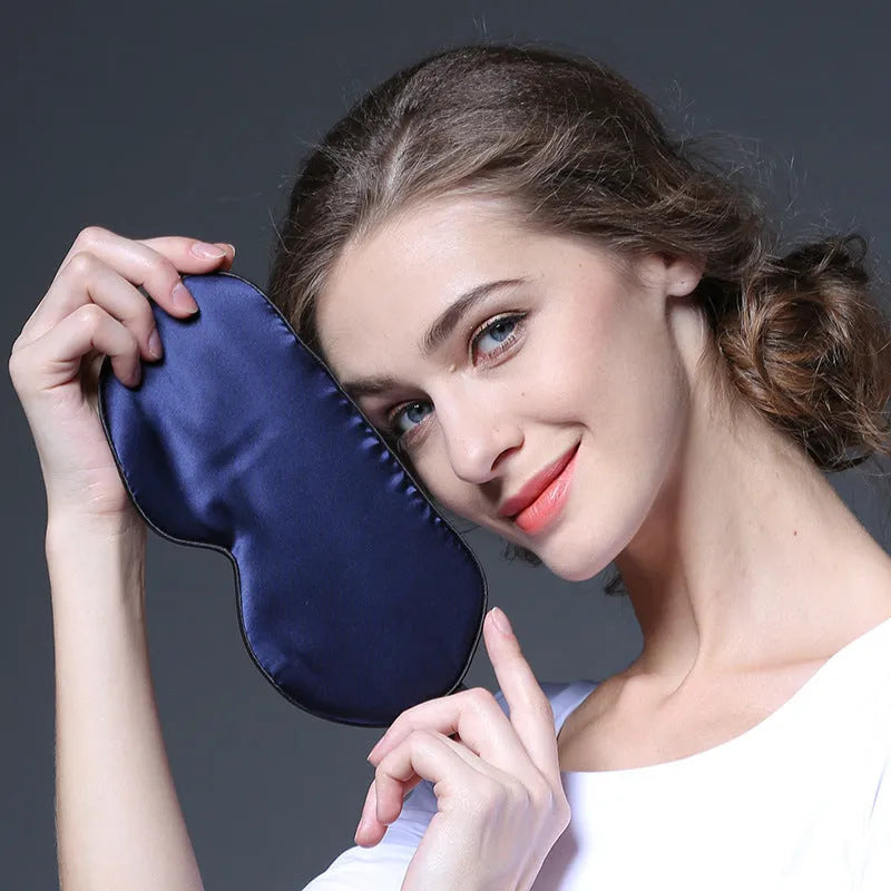 Double-sided mulberry silk eye mask showing embroidered print, in 22cm by 11cm size.