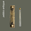 Industrial retro style iron flute wall lamp in antique finish, tall vertical design.