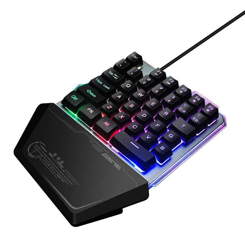 Black G40 Flow Colour one-handed mechanical keyboard with RGB backlit keys on a desk.