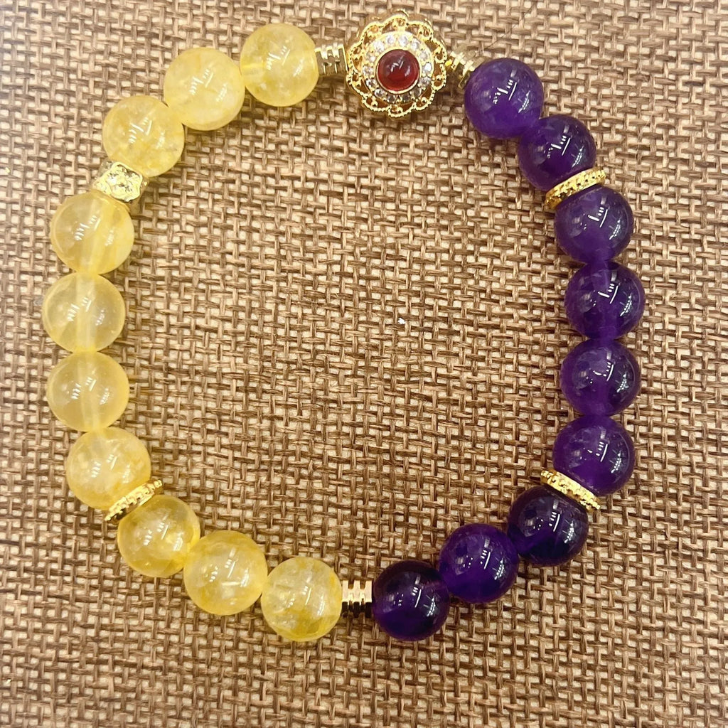 Handmade women's bracelet with yellow and purple crystal amethyst stones on adjustable clasp