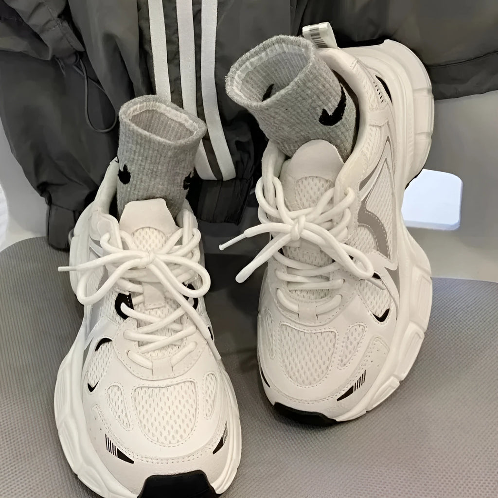 Beige mesh platform sports shoes with wedge heel and lace-up front on white background