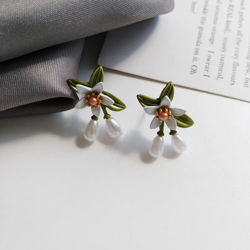 Women's camellia flower earrings set with sterling silver needle design in contrasting colours
