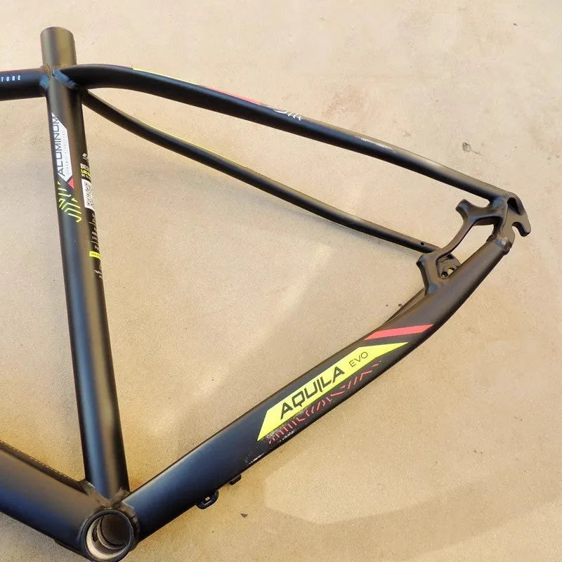 Black and green aluminium mountain bike frame with internal cable routing and disc brake mounts