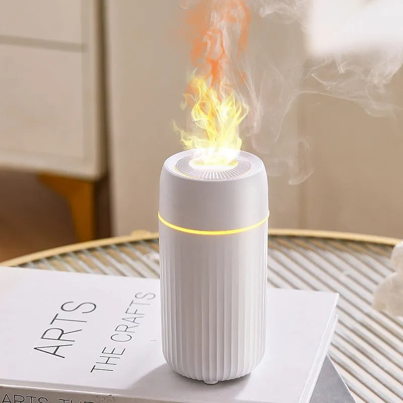 Black car aroma diffuser with flame simulation effect showing automatic sprayer functionality