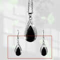 Black and red alloy teardrop pendant necklace with matching earrings set.
